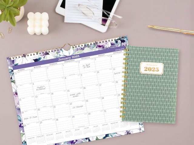 BADGE wall calendar and planner on modern desk setting