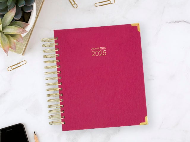 Harmony planner on marble desk setting